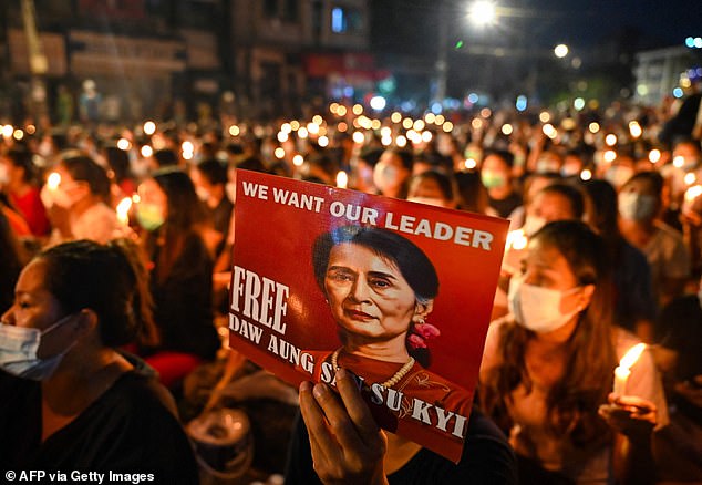 This image has an empty alt attribute; its file name is 40632336-9376241-Suu_Kyi_s_face_has_frequently_appeared_on_posters_and_placards_h-a-2_1616079498351.jpg
